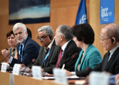 Intergovernmental Panel on Climate Change (IPCC) working group III co-chair Jim Skea (2nd L) answers a question during a press conference on a special IPCC report on climate change and land on August 8, 2019 in Geneva.