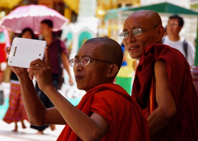 Monks at the Shwedagon Pagoda in Yangon, Myanmar.