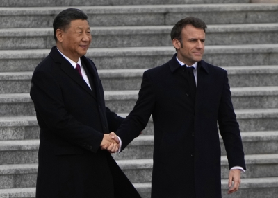 French President Emmanuel Macron shakes hands with Chinese President Xi Jinping during a welcome ceremony outside the Great Hall of the People on April 6, 2023 in Beijing, China.