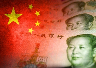 Chinese yuan cash bills and Chinese flag (money, economy, finance, inflation, crisis)