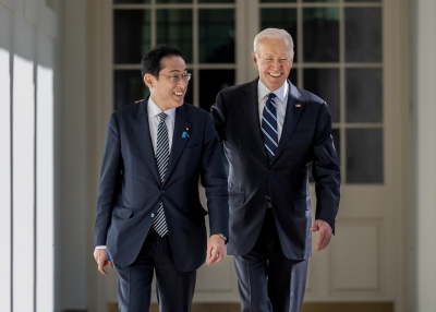 President Joe Biden walks along the West Colonnade with Japanese Prime Minister Fumio Kishida, Friday, January 13, 2023, at the White House.