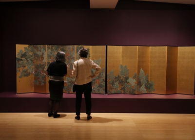 Asia Society Members Observing the Exhibit