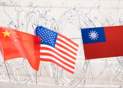 Flag Republic of China, USA - American and Flag of the Republic of China, (Taiwan) Waving In The Wind on barbed wire