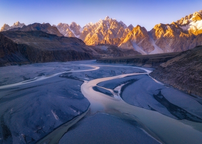 Aerial higher view of mountain peaks and River stream by mountains with Beautiful sunset in autumn season of Passu Valley