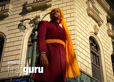 an image of swami vivekananda standing against a building in New York