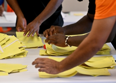 Solomon Islands electoral officers count votes