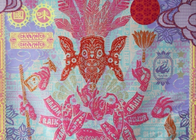 Detail of a tapestry of bright pink, autumn oranges, and lavender set against an aqua background.  The detail shows the upper body and headress of a figure dressed in what looks like layers of feathers in bright pink..