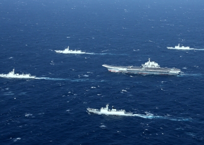 Chinese navy formation, including the aircraft carrier Liaoning during military drills in the South China Sea. 