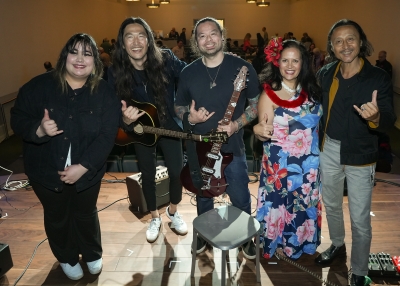 Daniel Pak, his band, Zheng Chongbin, and Trila Bumstead stand together onstage at the end of the evening.