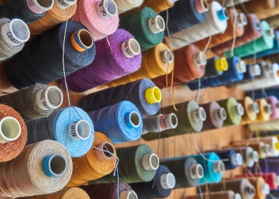 Bolts of thread on a wall