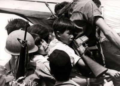 South Vietnamese children are separated from their parents as people fight to be on the last plane out of Nha Trang, South Vietnam on Mar. 31, 1975. (Jean-Claude Francolon / Liaison Agency)