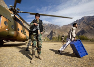 Afghan workers unload election material from a helicopter on Nov. 1, 2009 in the remote village of Pajwar. (Paula Bronstein/Getty Images)