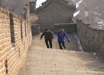 Greg Matza and Howie Southworth climb the Great Wall of China.