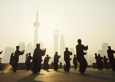 Shanghai residents practicing tai chi, outdoors, at dawn. (Kevin Phillips/Getty Images)