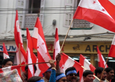 Demonstrators wave flags in Kathmandu, Nepal.