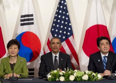 L to R: South Korean President Park Geun-hye, U.S. President Barack Obama, and Japanese Prime Minister Shinzo Abe at the U.S. ambassador's residence in The Hague on March 25, 2014. (Saul Loeb/AFP/Getty Images)