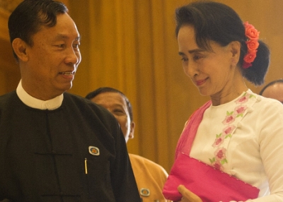 Myanmar's parliamentary speaker Shwe Mann (L) and Chairperson of the National League for Democracy (NLD) Aung San Suu Kyi (R) shake hands before their meeting at Parliament in Naypyidaw on November 19, 2015. (Ye Aung Thu/Getty Images)