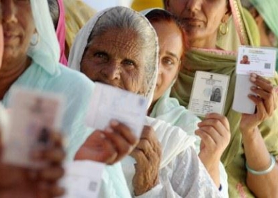 Indian voters display their ID cards prior to casting their ballots at a polling station near Attari village, about 35 kms from Amritsar, on April 30, 2014. (Narinder Nanu/AFP/Getty Images)