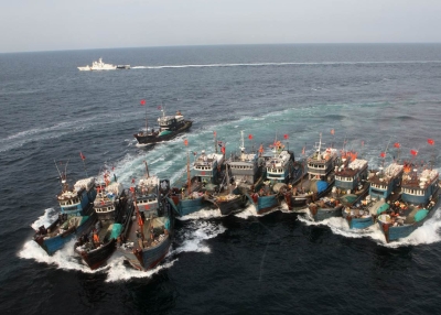 A photo taken on November 16, 2011 shows Chinese boats being chased after alleged illegal fishing in South Korean waters in the Yellow Sea. (Dong-A Ilbo/AFP/Getty Images)