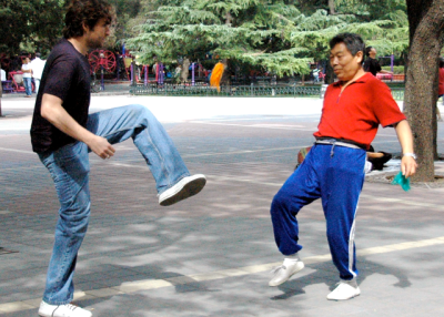 Joshua (left) playing jianzi, a Chinese game similar to hacky sack, in a Beijing park. (Joshua Halpern)