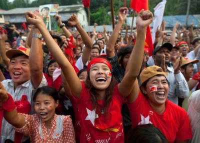 National League for Democracy (NLD) supporters celebrate their victory in parliamentary elections outside party headquarters on April 1, 2012 in Yangon, Myanmar. (Paula Bronstein/Getty Images)