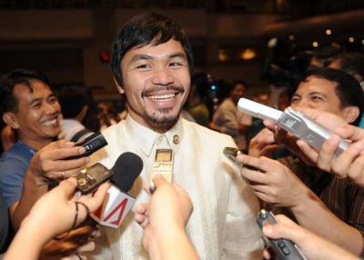 Philippine boxing hero and now congressman Manny Pacquiao speaks to members of the media during an orientation seminar at the House of Representatives in Manila on July 8, 2010. (Ted Aljibe/AFP/Getty Images)