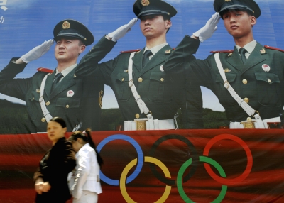 BEIJING, CHINA - MAY 4: Women walk past a Beijing Olympic Games billboard in Beijing. (LIU JIN/AFP/Getty Images)