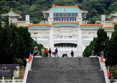 Tourists walk in front of the National Palace Museum in Taipei on January 6, 2009. The museum and its counterpart in Beijing plan to hold a joint exhibition of artifacts and arrange exchange of visits by their officials, in yet another sign of fast improving ties between Taiwan and rival China (SAM YEH/AFP/Getty Images).