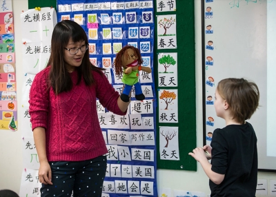 Using puppets and other props helps teachers make Chinese fun and engaging.