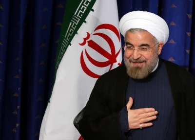Iran's President Hassan Rouhani adresses his first news conference since upon office, in Tehran, on August 6, 2013. (ATTA KENARE/AFP/Getty Images) 