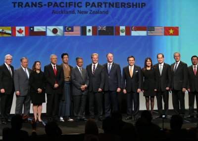 New Zealand Prime Minister John Key and Ministerial Representatives from 12 countries pose for a photo after signing the Trans-Pacific Partnership agreement in Auckland on February 4, 2016. (Michael Bradley/AFP/Getty Images)