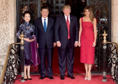 President Donald Trump and First Lady Melania Trump pose for a photo with Chinese President Xi Jingping and his wife, Mrs. Peng Liyuan, Thursday, April 6, 2017, at the entrance of Mar-a-Lago in Palm Beach, FL (Official White Photo by D. Myles Cullen)