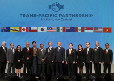 New Zealand Prime Minister John Key (C) joins ministers from 12 countries after the signing of the TPP at Sky City on February 4, 2016 in Auckland, New Zealand. (Photo by Fiona Goodall/Getty Images)