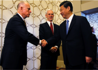 Then-Chinese Vice President Xi Jinping (R) greets California Governor Jerry Brown (L) as Commerce Secretary John Bryson looks on before the U.S.-China Economy and Trade Cooperation Forum on Feb. 17, 2012 in Los Angeles. (Robert Gauthier-Pool/Getty Images)