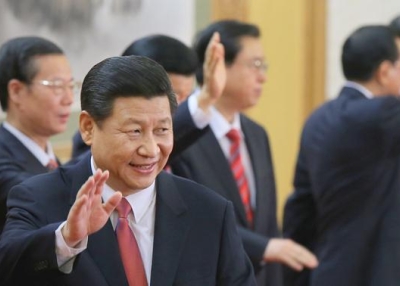 Xi Jinping (foreground), China's new Communist Party General Secretary, waves with other members of the new  Politburo Standing Committee in the Great Hall of the People in Beijing, China on November 15, 2012. (Feng Li/Getty Images)