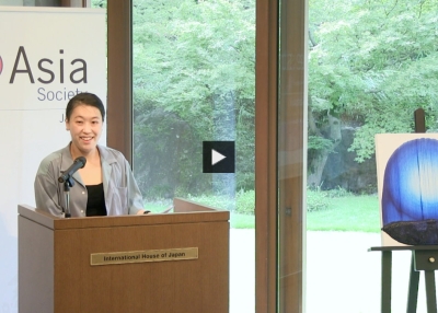 Mina Katsuki giving a presentation