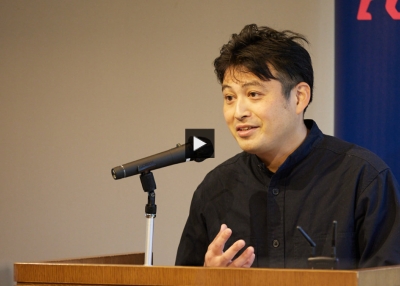 Mitsumasa Kadota on podium at Art for Breakfast