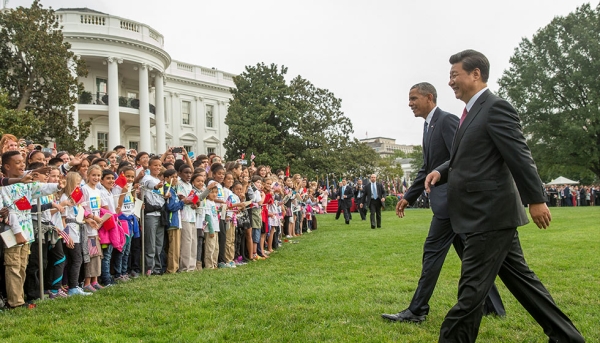 Yu Ying students wait on the South Lawn of the White House to meet President Xi Jinping and President Obama while attending President Xi's welcome ceremony. (Evan Vucci/Associated Press)