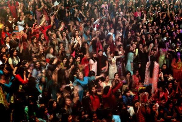 Pakistani female students enjoy the performance of the band Overload during a concert in Kinnaird women's college in Lahore on Feb. 6, 2010. (Behrouz Mehri/AFP/Getty Images)