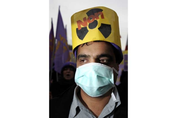 A member of the Iranian opposition wearing a mask reading "No to Nuclear" attends a protest at the "Place des Nations" on December 6, 2010 in Geneva. (Fabrice Coffrini/AFP/Getty Images) 