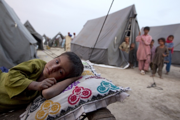 A boy rests at a new camp which opened for flood victims on August 14, 2010 in Sukkur. Pakistanis have become increasingly outraged with their government&apos;s slow response to the disaster and a lack of foreign aid. (Paula Bronstein/Getty Images)