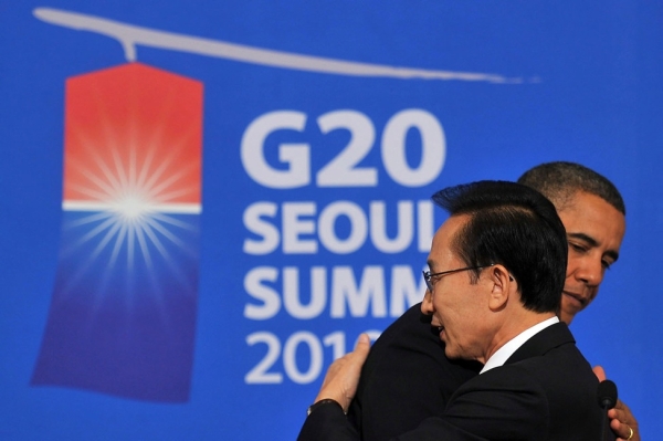In this handout provided by the South Korean Presidential House, President Obama and South Korean President Lee Myung-bak hug each other during a joint press conference after their summit meeting at the Presidential Blue House on November 11, 2010 in Seoul, South Korea. World leaders converged on Seoul for the fifth meeting of the G20 group of nations to discuss the global financial system and world economy. (Photo by South Korean Presidential House via Getty Images)