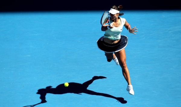 Li Na of China plays a forehand in her semifinal match against Caroline Wozniacki of Denmark during day eleven of the 2011 Australian Open on January 27, 2011 in Melbourne, Australia. (Mark Kolbe/Getty Images)