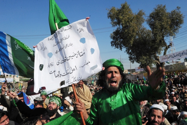 Activists of the Pakistani fundamentalist Islamic party Jamaat-i-Islami shout slogans calling for an en end to American drone attacks in tribal areas on January 23, 2011 during an anti-US protest rally in Peshawar. (A Majeed /AFP/Getty Images) 