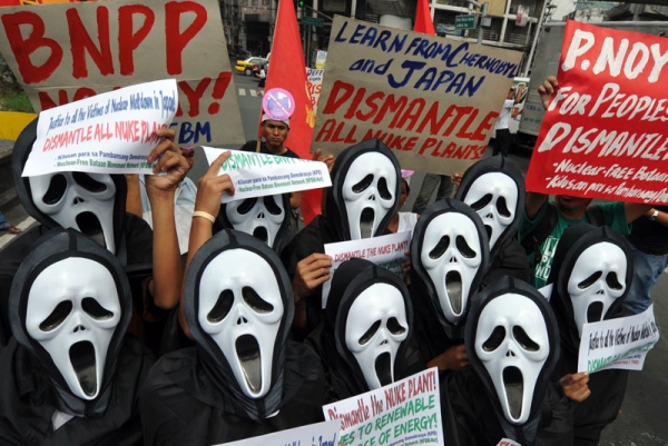 Anti-nuclear activists hold a protest near the presidential palace in Manila on March 15, 2011. (TED ALJIBE/AFP/Getty Images)