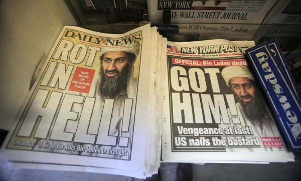 Newspapers announcing the death of accused 9-11 mastermind Osama bin Laden are seen at a newsstand outside the World Trade Center site May 2, 2011 in New York City. (Mario Tama/Getty Images)