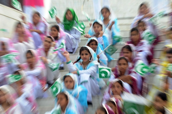 Pakistani students wave national flags at the mausoleum of the founder of Pakistan Muhammad Ali Jinnah in Karachi on August 14, 2011, to mark the 64th Independence Day of Pakistan. (Rizwan Tabassum/AFP/Getty Images)