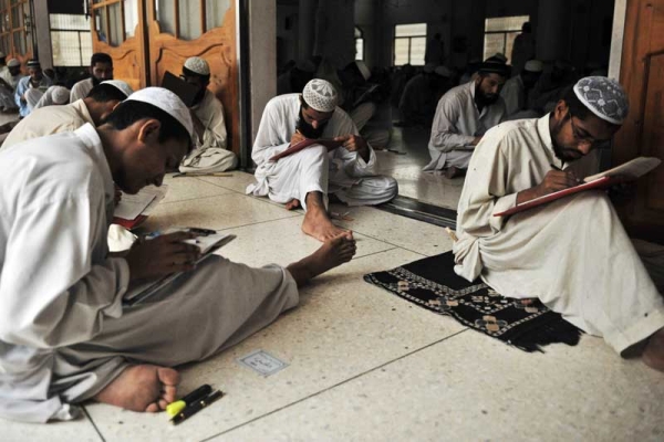 Pakistani and foreign religious students taking an exam at the Jamia Binoria madrasa in Karachi in 2009. (Rizwan Tabassum/AFP/Getty Images) 