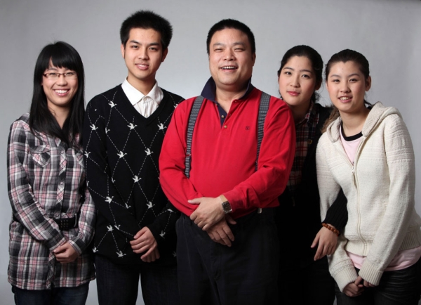 Xiao Baiyou, China's "Wolf Dad," surrounded by his four children.