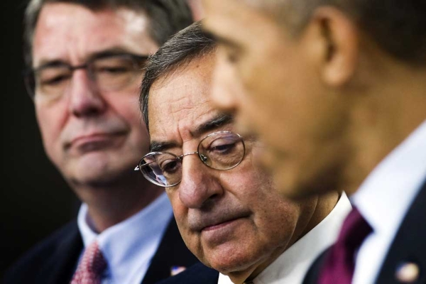 U.S. Defense Secretary Leon Panetta (C) listens as U.S. President Barack Obama (R) delivers remarks on the Defense Strategic Review at the Pentagon in Washington, D.C. Also pictured is Deputy Secretary of Defense Ashton Carter (L). President Obama vowed Thursday that the U.S. military would maintain its "superiority" and bolster its presence in Asia despite planned cuts to the defense budget. (Jim Watson/AFP/Getty Images)